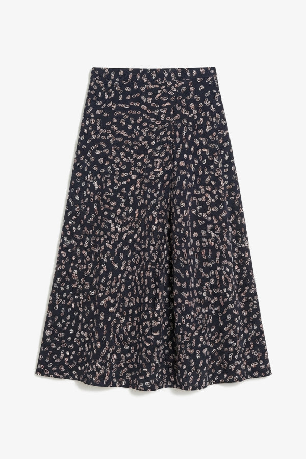 ara skirt in spin dot pattern on white background. | Still | Exclude