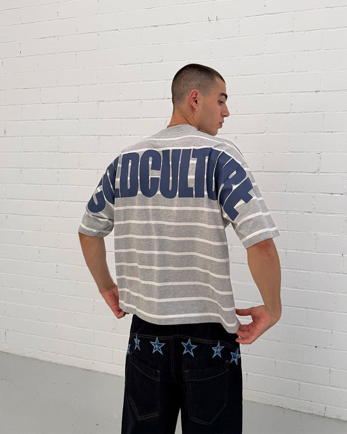 BAY STRIPE TEE GREY - grey striped tee, back view on male model - Cold Culture