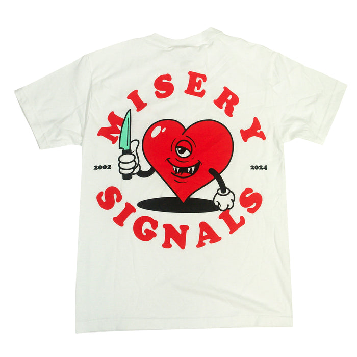 White Misery Signals cotton t-shirt with a cartoon heart holding a knife, winking and smirking, surrounded by red MISERY SIGNALS text and the years “2002” and “2024.” Relaxed fit for all-day comfort.