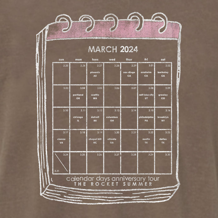 A hand-drawn March 2024 calendar page lists The Rocket Summers tour dates. Its pink header and spiral binding complement the soft vibe of their Comfort Colors Tees, highlighting the brands unique style.
