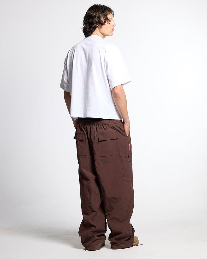 COLLECTIVE TEE WHITE - white graphic print tee, back view on male model - Cold Culture