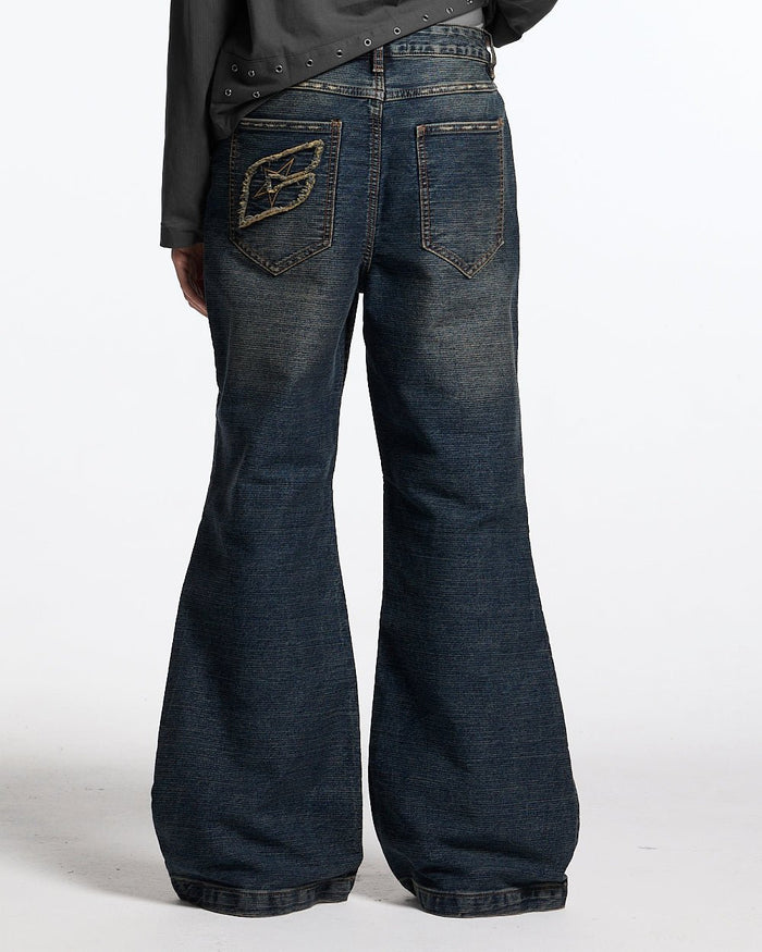 CONCRETE BOOTCUT JEANS BLUE - washed blue bootcut jeans, back view on female model - Cold Culture #woman