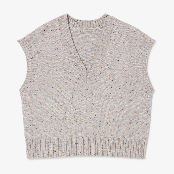 Beige knitted vest on a white background | Still