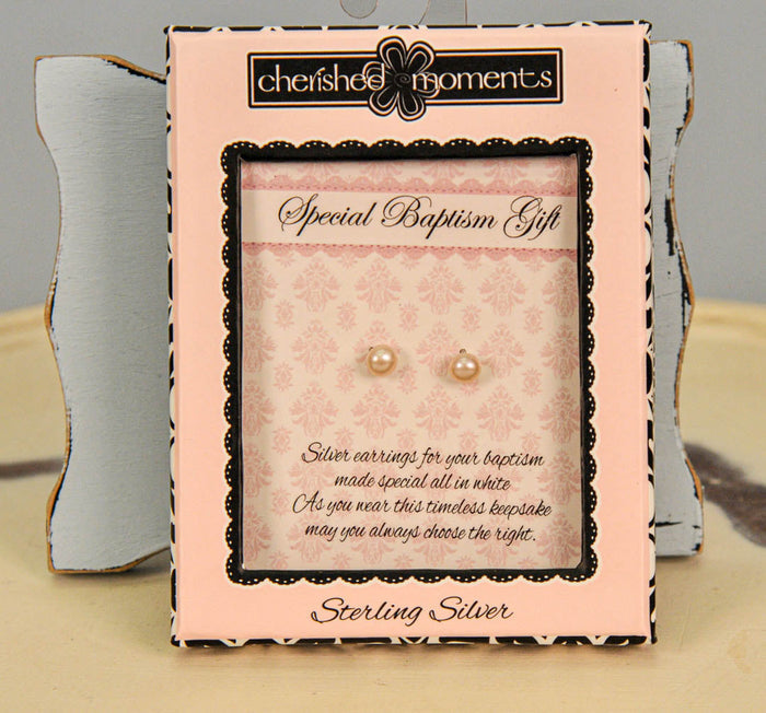 Pearl stud earrings in box.