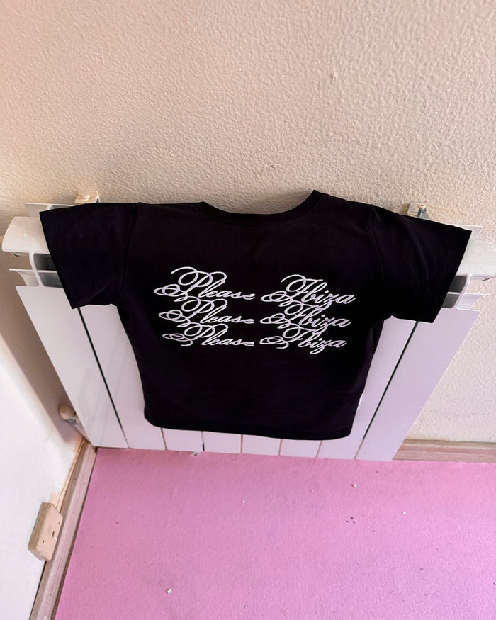 PLEASE IBIZA BABY TEE BLACK - black graphic print baby tee, flat lay - Cold Culture