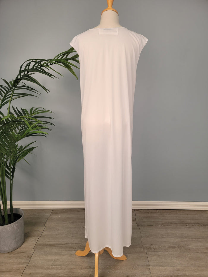 Raglan sleeve full length slip with pocket at hem.