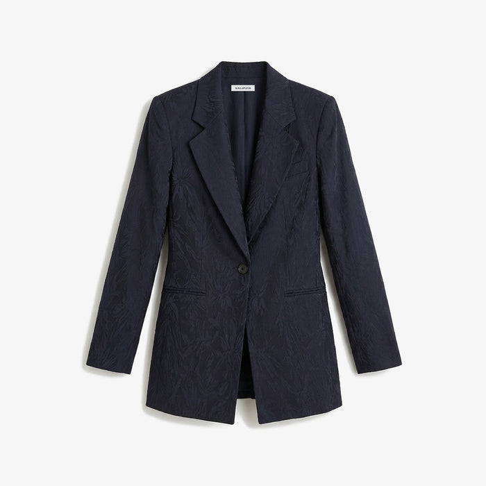Navy blazer on a light gray background