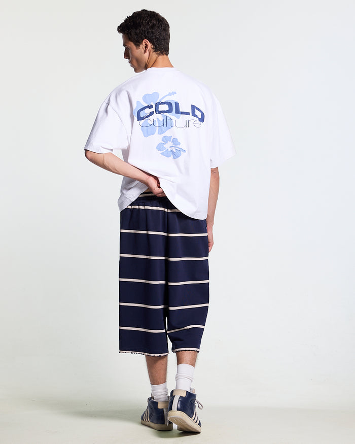 TROPICAL FEVER TEE WHITE - white hibiscus print tee, back view on male model - Cold Culture