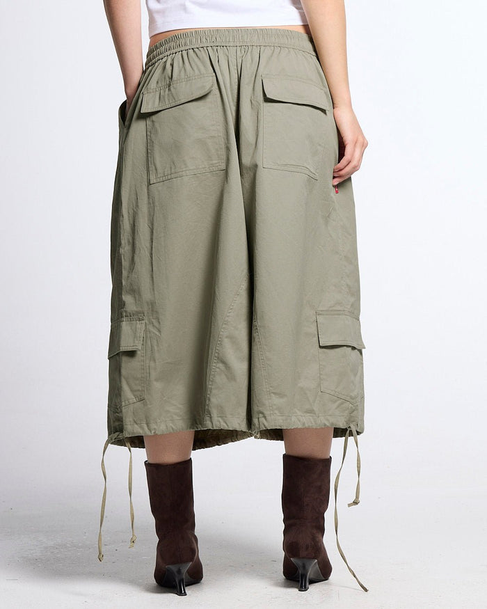 UTILITARY CAPRI PARACHUTE CREAM - khaki cargo capri shorts, back view on female model - Cold Culture