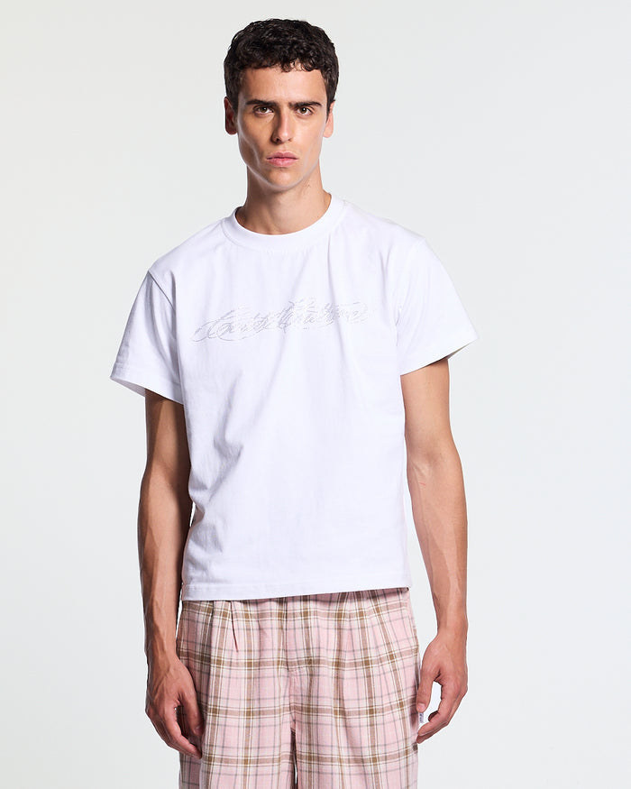 BLING TEE WHITE - white rhinestone script tee, front view on male model - Cold Culture