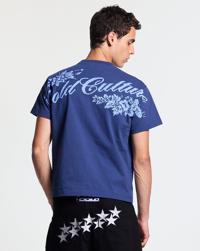 BLOOM TEE NAVY - navy floral print tee, back view on male model - Cold Culture