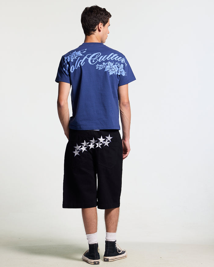 BLOOM TEE NAVY - navy floral print tee, back view on male model - Cold Culture