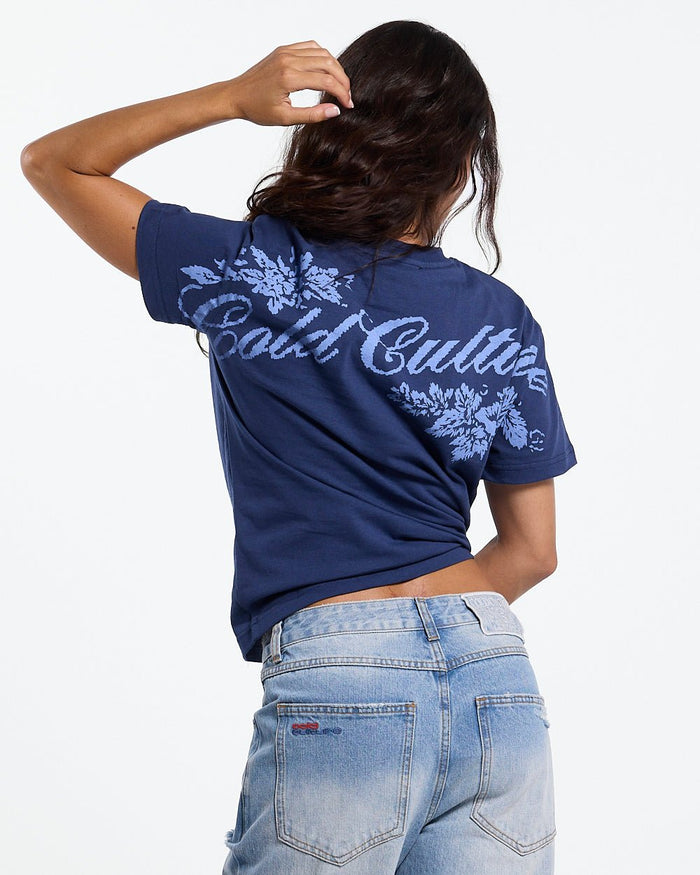 BLOOM TEE NAVY - navy floral print tee, back view on female model - Cold Culture