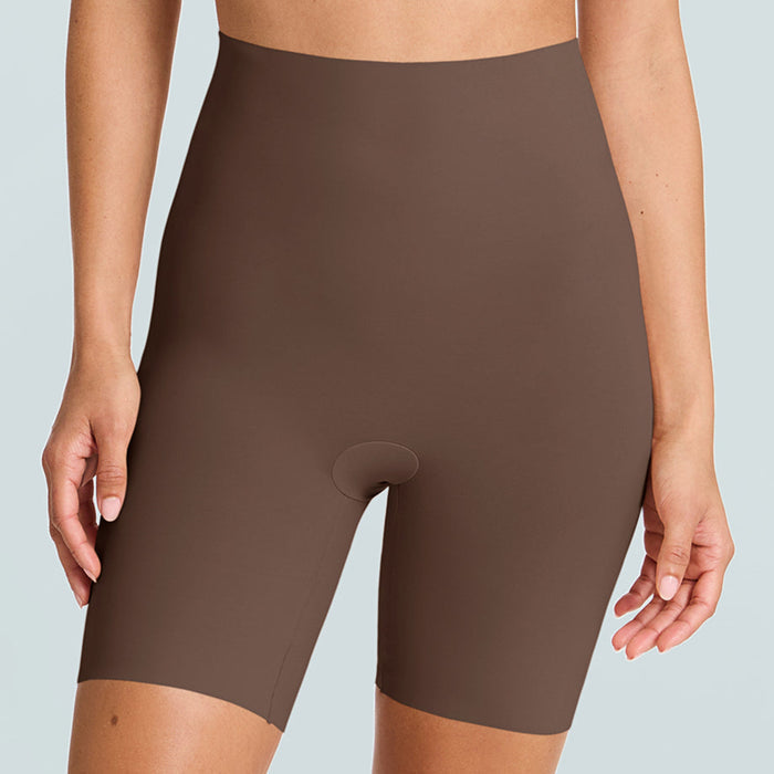 Brown shapewear shorts worn by a person on a light gray background