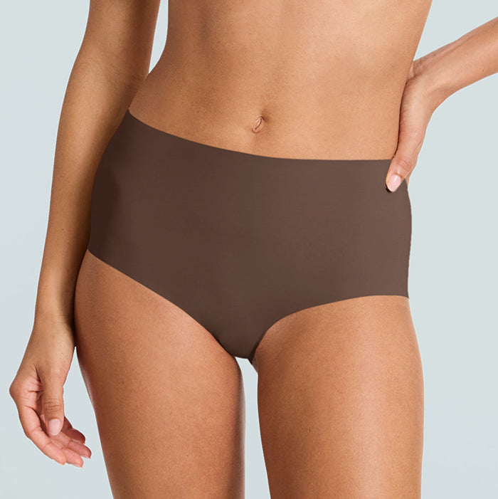 Brown high-waisted underwear worn by a person on a light gray background