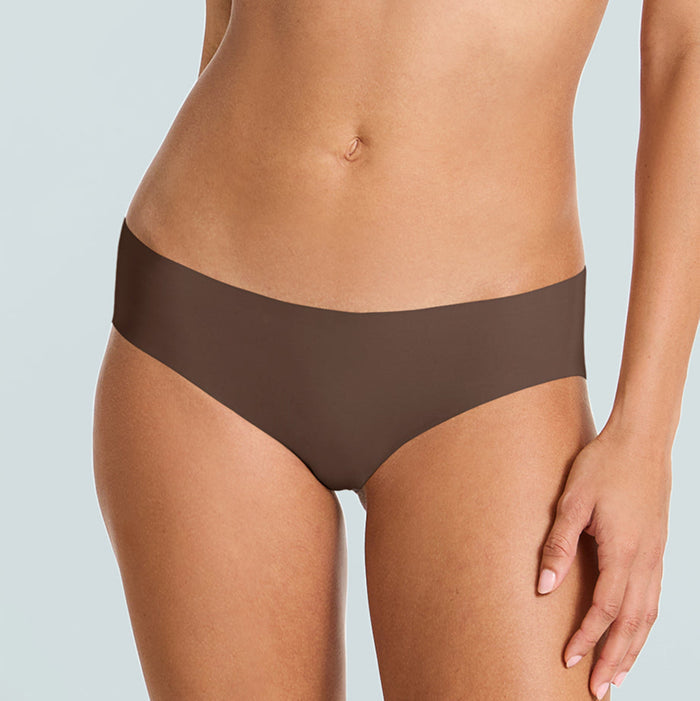 Brown underwear worn by a person on a light gray background