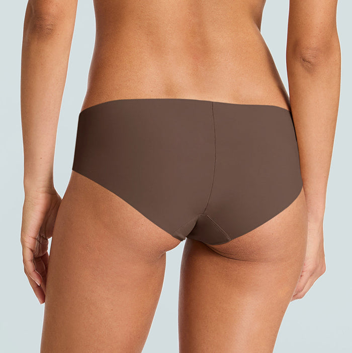 Brown underwear worn by a person on a light gray background