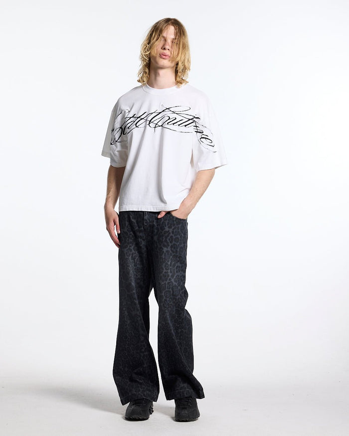 CROSSED SCRIPT TEE 2.0 WHITE - white script print tee, front view on male model - Cold Culture