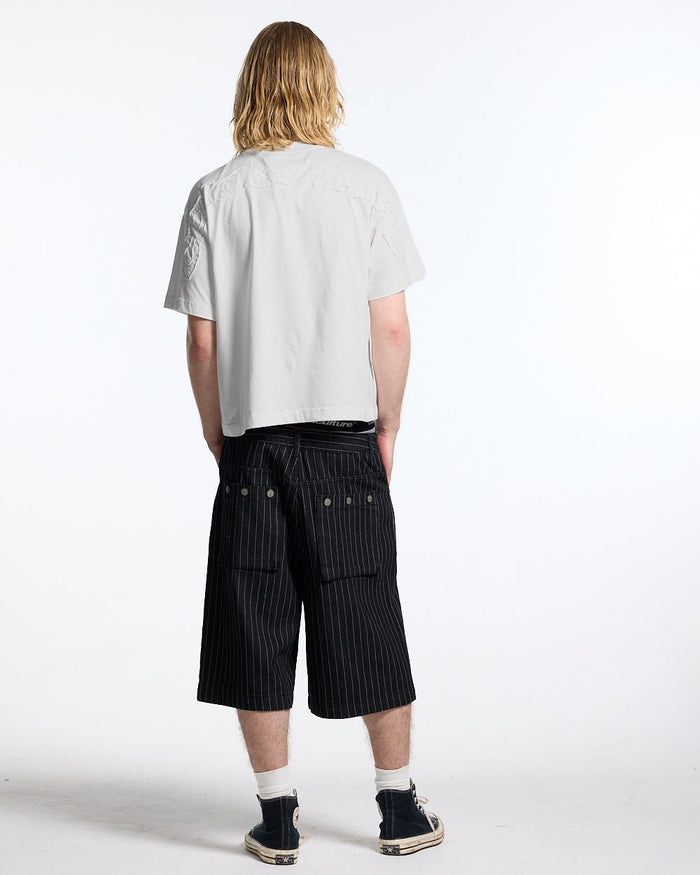 DISTRESS CURVED TEE WHITE - white boxy tee, back view on male model - Cold Culture