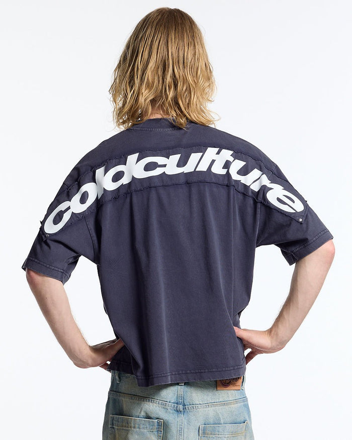 FULL ON WASHED TEE BLUE - washed navy blue tee, back view on male model - Cold Culture