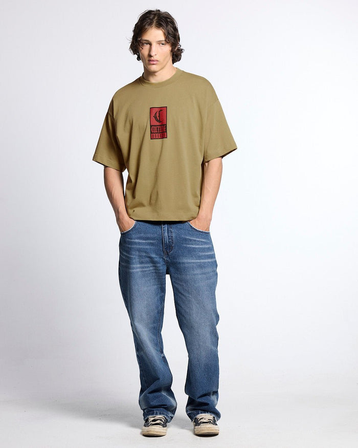 GOTHIC CURVED TEE GREEN - green gothic print tee, front view on male model - Cold Culture