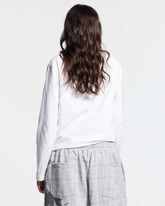 IDENTITY LONGSLEEVE WHITE - white embroidered longsleeve tee, back view on female model - Cold Culture