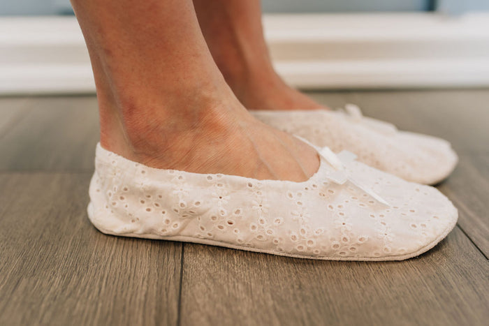 White lace padded slipper side view.
