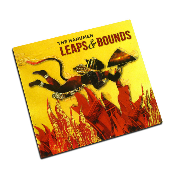 Album cover for Leaps & Bounds by The Hanumen shows a stylized figure leaping over red flames, holding a mountain, with a bright yellow background—art inspired by Bhaja Govindam.
