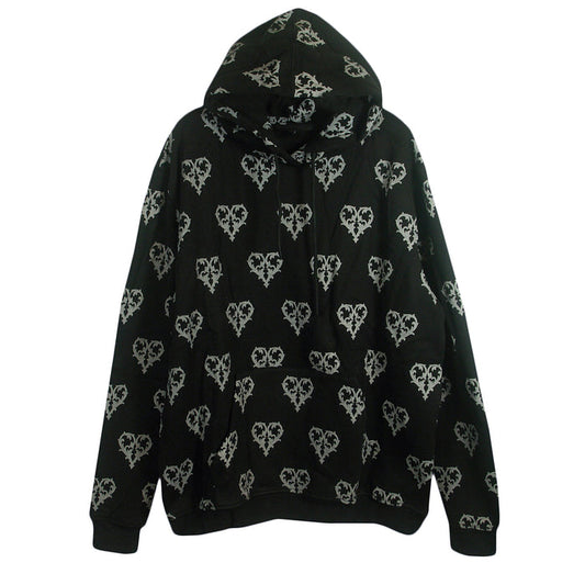 The Ricky Olson black hooded sweatshirt features a white barbed wire heart pattern all over, long sleeves, ribbed cuffs and waistband, relaxed fit, and is made from a cotton/polyester blend.