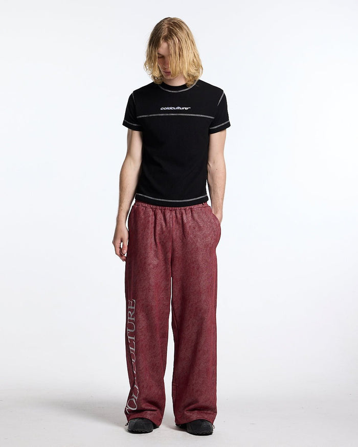 MERRY SWEATPANTS RED - washed red sweatpants, front view on male model - Cold Culture #man