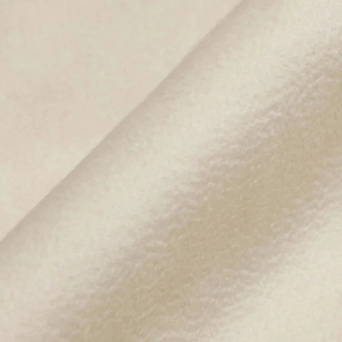 Close-up of beige fabric with a subtle texture