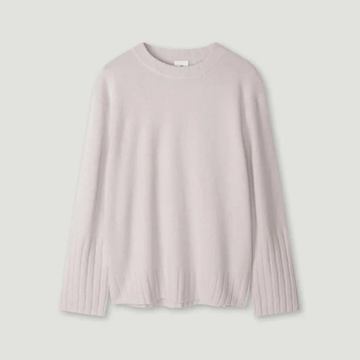 Light pink sweater on a light gray background | Lead