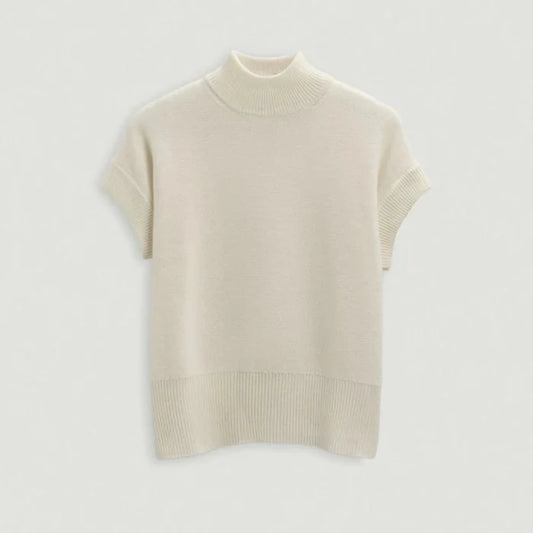 Beige turtleneck sweater on a light gray background | Lead