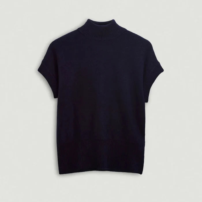 Navy turtleneck sweater on a light gray background | Lead