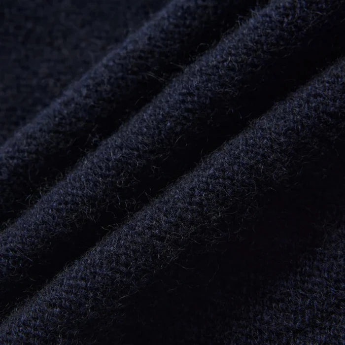 Close-up of dark blue fabric with a textured pattern