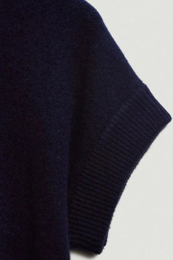 Navy blue sweater sleeve on a light gray background | Exclude