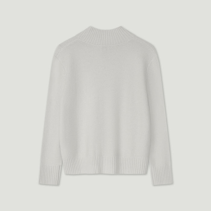 Light gray sweater on a light gray background