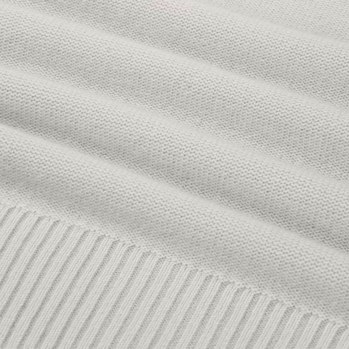 Close-up of light gray fabric with subtle texture and stripes.