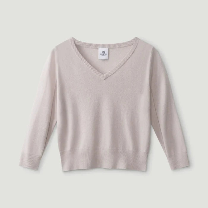 Beige long-sleeve top on a light gray background | Lead