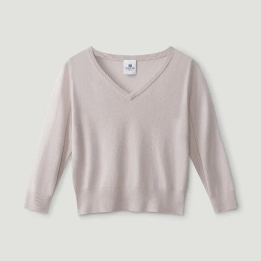 Beige long-sleeve top on a light gray background | Lead
