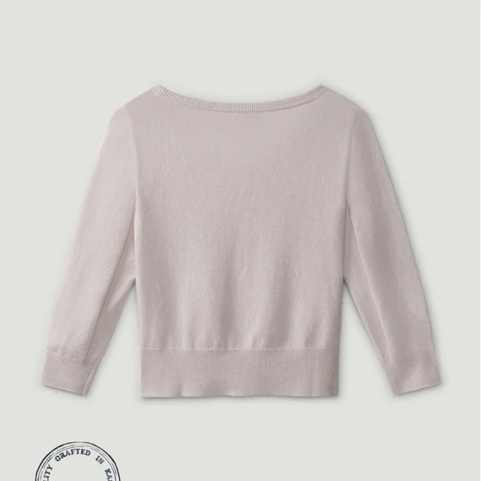Light purple sweater on a light gray background