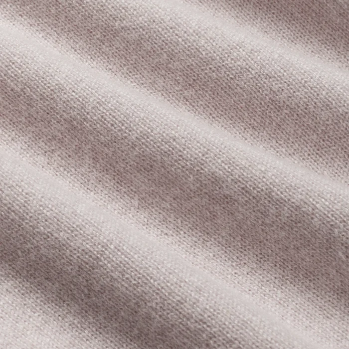 Close-up of a textured beige fabric surface