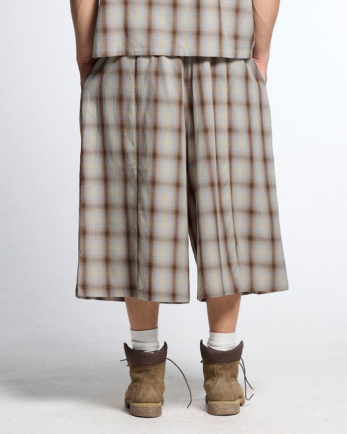 OFFICE SCRIPT SHORTS BEIGE - beige plaid wide leg shorts, back view on male model - Cold Culture