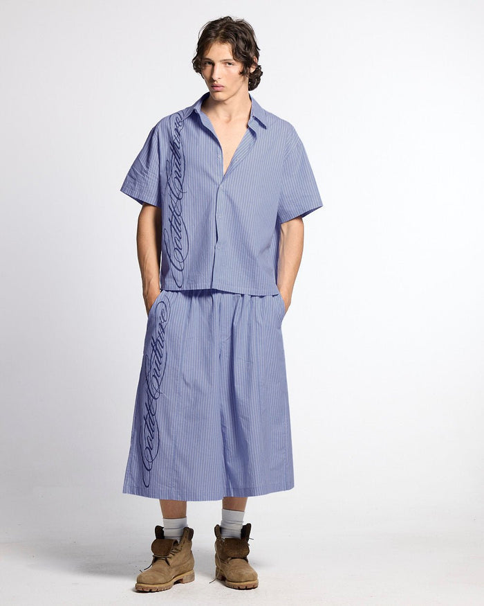 OFFICE SCRIPT SHORTS BLUE - blue striped wide leg shorts, front view on male model - Cold Culture