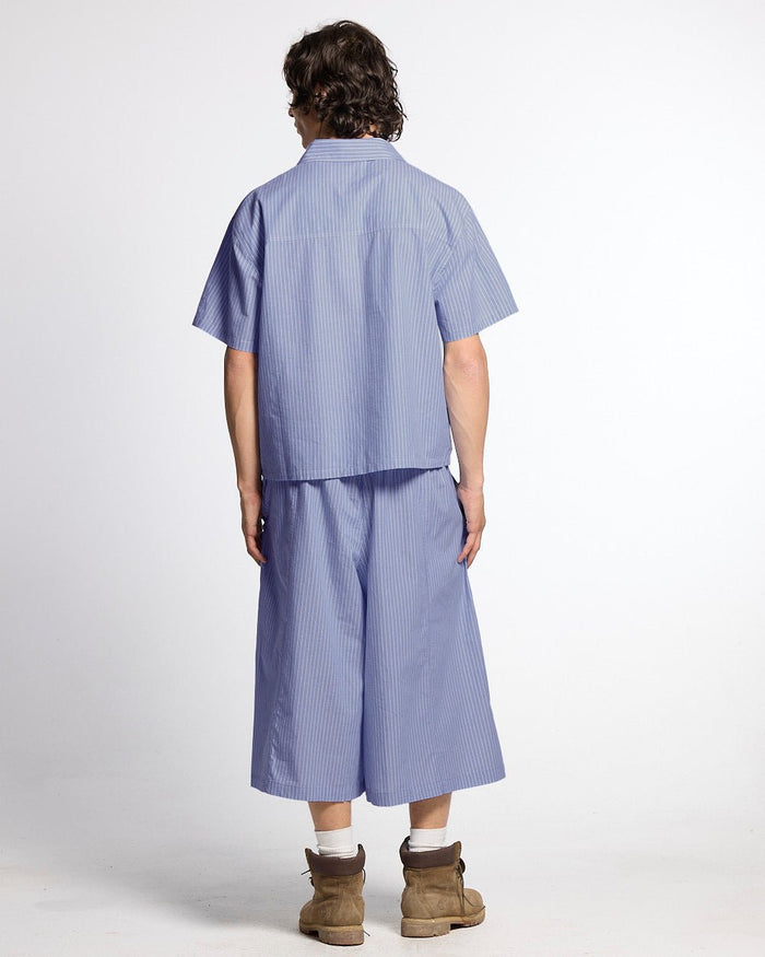 OFFICE SCRIPT SHORTS BLUE - blue striped wide leg shorts, back view on male model - Cold Culture