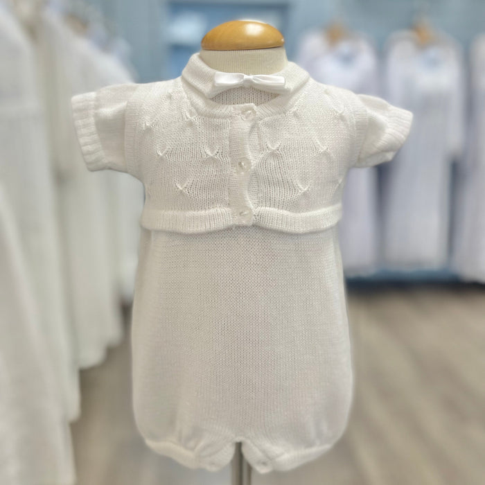 White knit baby boy romper with vest and bowtie.