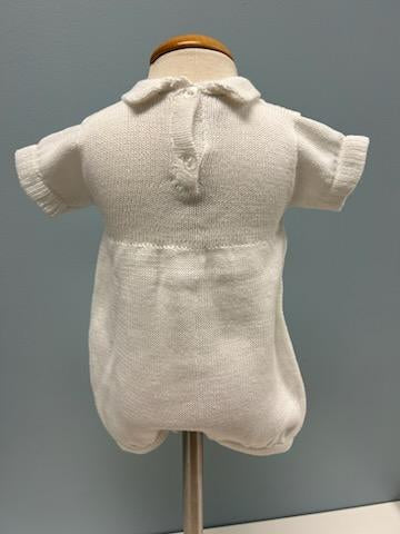 Back of white knit baby romper.