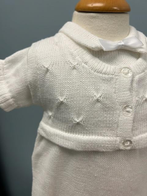 White knit baby boy romper with vest and bowtie.