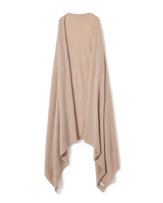 Beige poncho draped over a mannequin on a white background | Lead