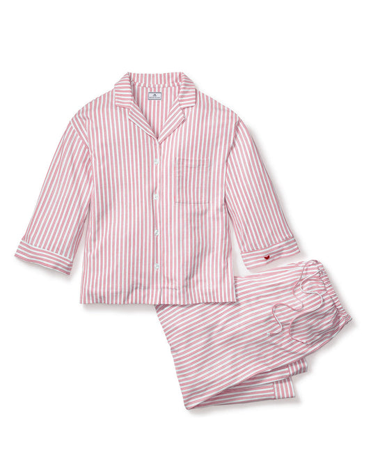 Pink and white striped pajama set on a white background | Lead